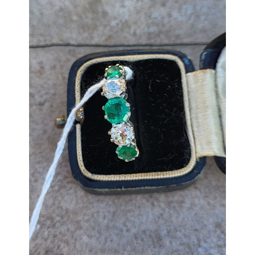 196A - AN EARLY 20TH CENTURY DIAMOND AND EMERALD FIVE STONE PLATINUM RING
Three round cut emeralds interspe... 