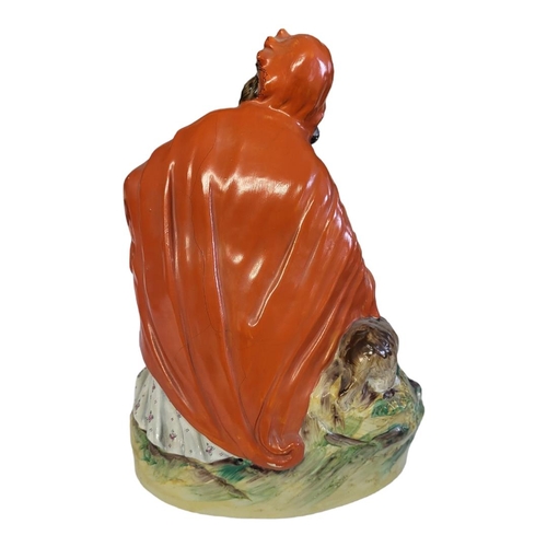 286 - STAFFORDSHIRE, A FIGURAL GROUP OF LITTLE RED RIDING HOOD
Polychrome painted with bright multicoloure... 