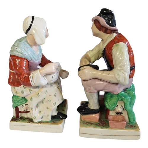 267 - STAFFORDSHIRE, A PAIR OF FIGURES BY KENT MODELLED AS THE COBBLER AND HIS WIFE 
Raised on square base... 