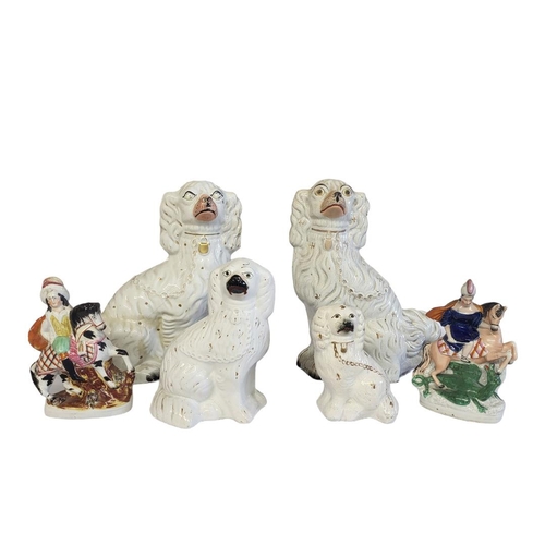 268 - A PAIR OF LARGE 19TH CENTURY STAFFORDSHIRE POTTERY DOGS 
Together with two smaller polychromed Staff... 