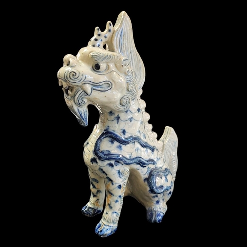 263 - A CHINESE BLUE AND WHITE PORCELAIN TEMPLE DRAGON
Standing pose with hand painted decoration.
(approx... 