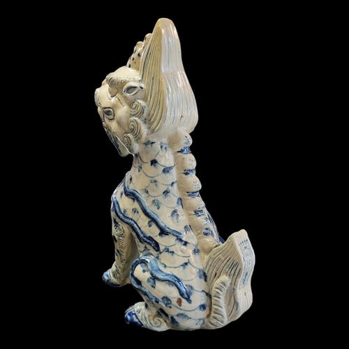 263 - A CHINESE BLUE AND WHITE PORCELAIN TEMPLE DRAGON
Standing pose with hand painted decoration.
(approx... 