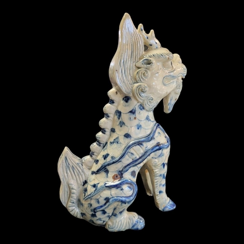 263 - A CHINESE BLUE AND WHITE PORCELAIN TEMPLE DRAGON
Standing pose with hand painted decoration.
(approx... 