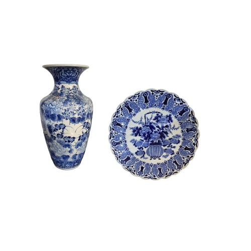 307 - AN EARLY 20TH CENTURY JAPANESE BLUE AND WHITE PORCELAIN VASE
Having flared rim and hand painted deco... 