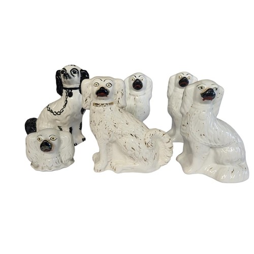 268 - A PAIR OF LARGE 19TH CENTURY STAFFORDSHIRE POTTERY DOGS 
Together with two smaller polychromed Staff... 