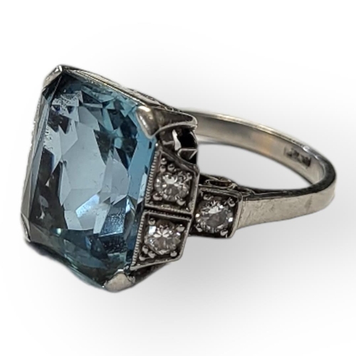 101 - A PLATINUM, AQUAMARINE AND DIAMOND RING
The single rectangular faceted cut stone flanked by round cu... 