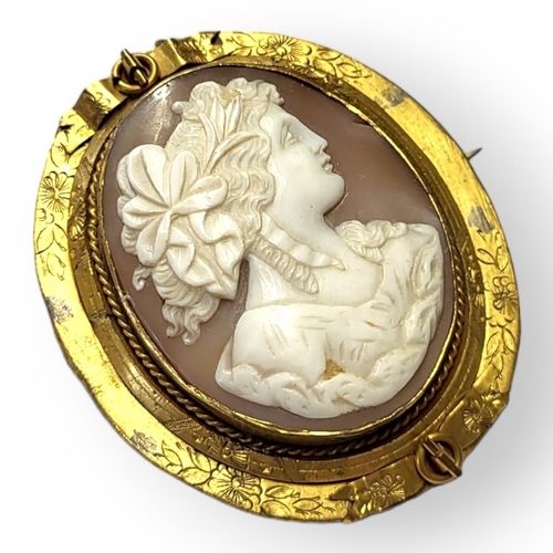 107 - A VICTORIAN YELLOW METAL AND OVAL SHELL CAMEO BROOCH
With carved female portrait within a cushion fr... 