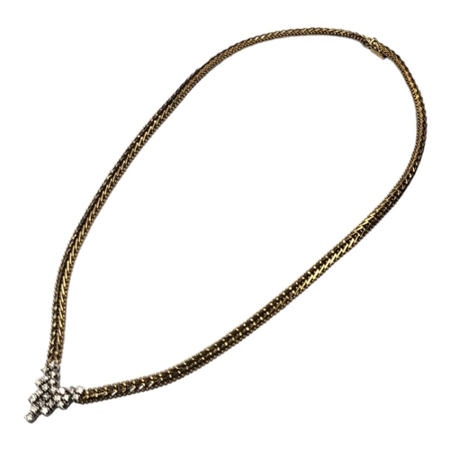 11 - AN ITALIAN 14CT GOLD AND DIAMOND NECKLACE
Having an arrangement of round cut diamonds in articulated... 