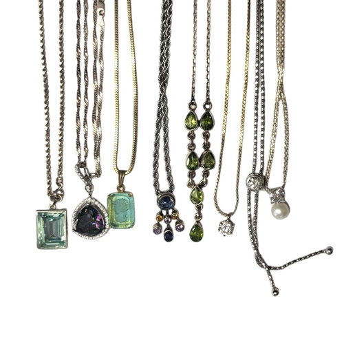 191 - A COLLECTION OF EIGHT SILVER AND PASTE PENDANT NECKLACES
To include a rainbow crystal edged with dia... 