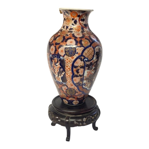 201 - A 19TH CENTURY JAPANESE IMARI PORCELAIN OVOID VASE
With central cartouche hand painted with bamboo a... 