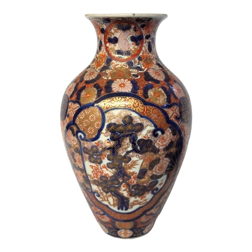 201 - A 19TH CENTURY JAPANESE IMARI PORCELAIN OVOID VASE
With central cartouche hand painted with bamboo a... 