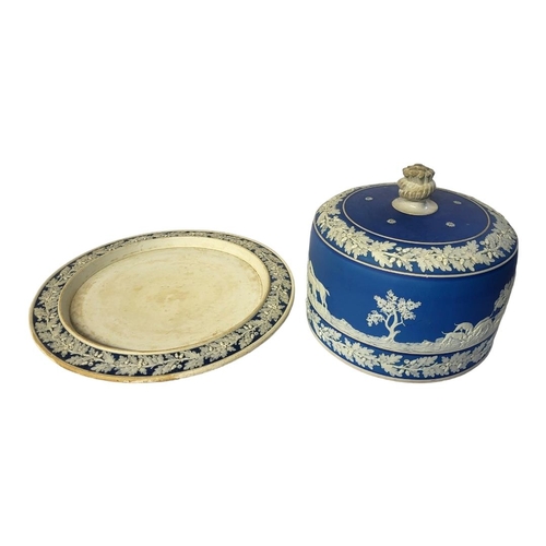 206 - A VICTORIAN JASPERWARE POTTERY STILTON CHEESE BELL
Having a dome form lid decorated with a fox hunti... 