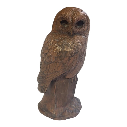 208 - A 20TH CENTURY BRONZE OWL
Having engraved decoration, initialled 'PS' to filled base.
(approx 18cm)
... 