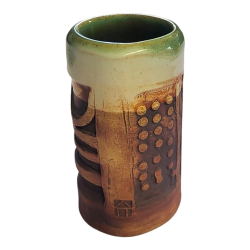 209 - A 20TH CENTURY ART POTTERY CYLINDRICAL VASE
Having a clevedon glaze interior and incised decoration ... 