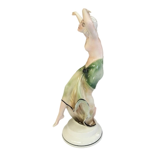 229 - THURINGIAN, AN ART DECO KATZHÜTTE GLAZED PORCELAIN MODEL OF A SEMI NUDE DANCER
Painted in pastel gla... 