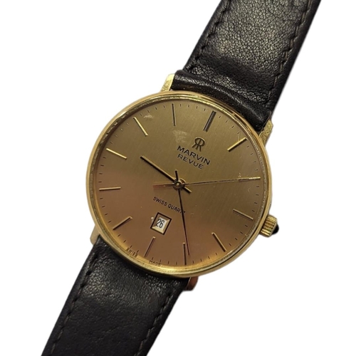 25 - MARVIN, A VINTAGE YELLOW METAL GENT’S WRISTWATCH
Having a gold tone dial, calendar window, on a brow... 