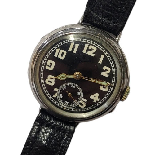 35 - AN EARLY 20TH CENTURY SILVER MILITARY WRISTWATCH
Circular black dial with luminous Arabic number mar... 