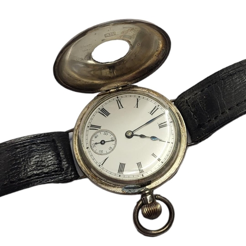 39 - AN EARLY 20TH CENTURY SILVER DEMI HUNTER GENTS WRISTWATCH
Having a glass aperture to hinged case, Ro... 