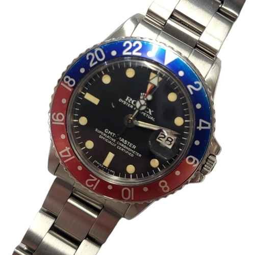 47 - ROLEX, GMT-MASTER, A VINTAGE STAINLESS STEEL GENT’S WRISTWATCH
Having a blue and red enamel 'Pepsi' ... 