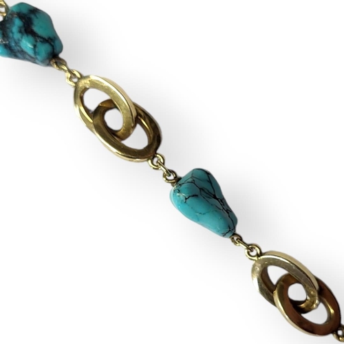 69 - A VINTAGE 14CT GOLD AND TURQUOISE BRACELET
Five turquoise beads interspersed with pierced oval links... 