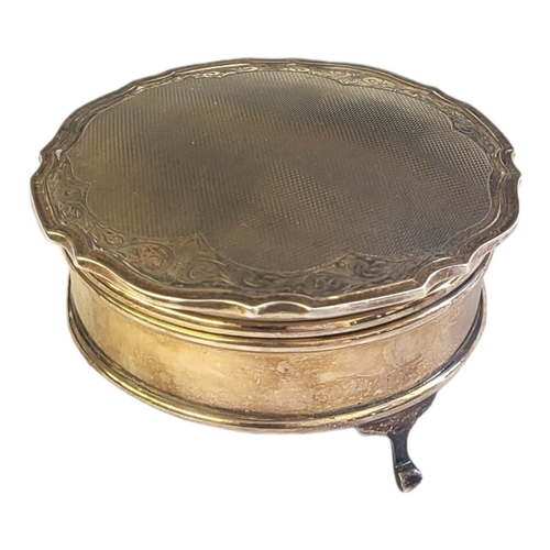 77 - A MID CENTURY SILVER CIRCULAR JEWELLERY BOX
With scalloped edge and engraved decoration, in a velvet... 