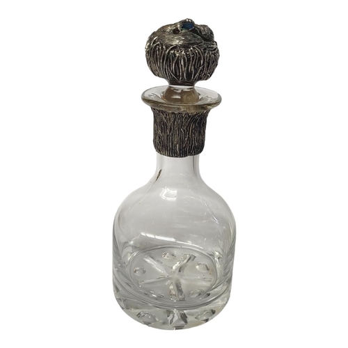 93 - A VINTAGE WHITE METAL, OPAL AND CUT GLASS FIGURAL DECANTER
Having an applied white metal duck billed... 