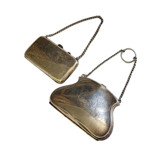 99 - AN EARLY 20TH CENTURY HALLMARKED SILVER CASED LADIES’ PURSE ON CHAIN 
Birmingham, 1915, with brown l... 