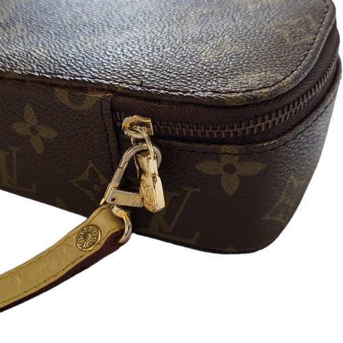 237 - LOUIS VUITTON, PARIS, A BROWN LEATHER LV MONOGRAM LADIES’ TRAVELLING/VANITY CASE
Yellow stained leat... 