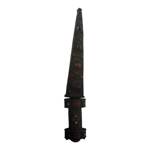 245 - A LATE 19TH/EARLY 20TH CENTURY INDIAN BRONZE DAGGER
The handle and scabbard encrusted with paste and... 