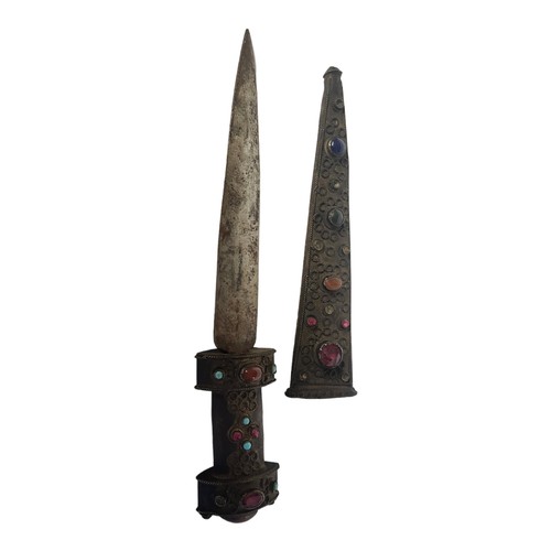 245 - A LATE 19TH/EARLY 20TH CENTURY INDIAN BRONZE DAGGER
The handle and scabbard encrusted with paste and... 