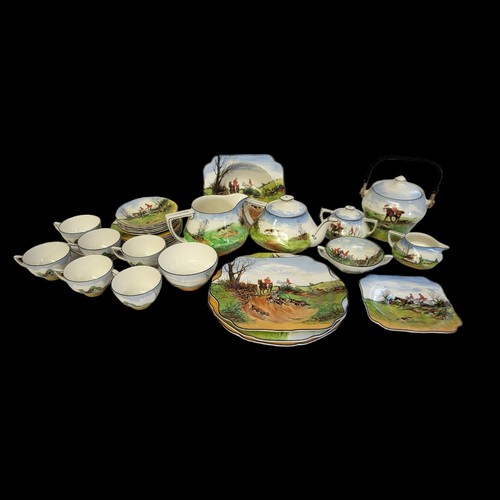 340 - CROWN DUCAL, AN ART DECO TEA/BREAKFAST SERVICE FOR SIX
Decorated with traditional English country hu... 