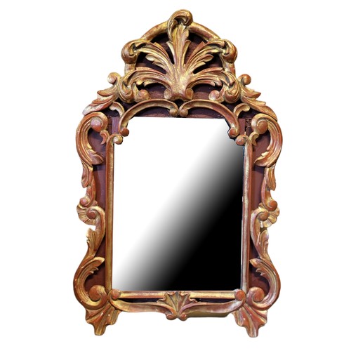 251 - A 19TH CENTURY CONTINENTAL GILT FRAMED MIRROR
With organic scroll decoration.
(49cm x 74cm)

Conditi... 