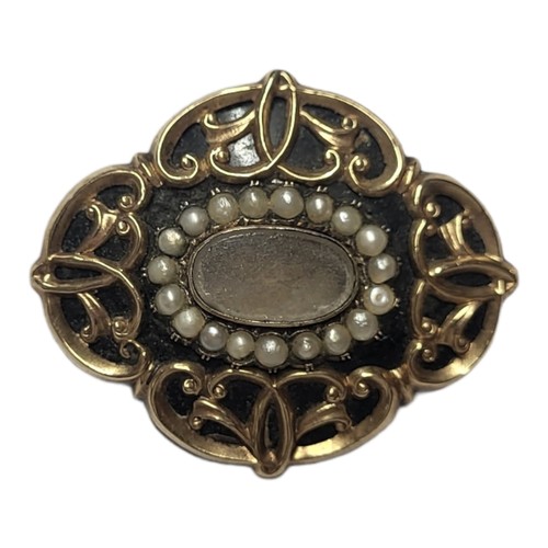 165 - A 19TH CENTURY YELLOW METAL SEED PEARL AND BLACK ENAMEL MOURNING BROOCH
Scrolled form with central g... 