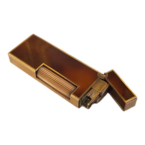 58 - DUNHILL, A VINTAGE GOLD PLATE AND BROWN LACQUER CIGARETTE LIGHTER
Rectangular form with flip lid, ma... 