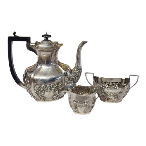 114 - AN VICTORIAN SILVER THREE PIECE COFFEE SET
Having an ebonised wooden finial and handle and embossed ... 