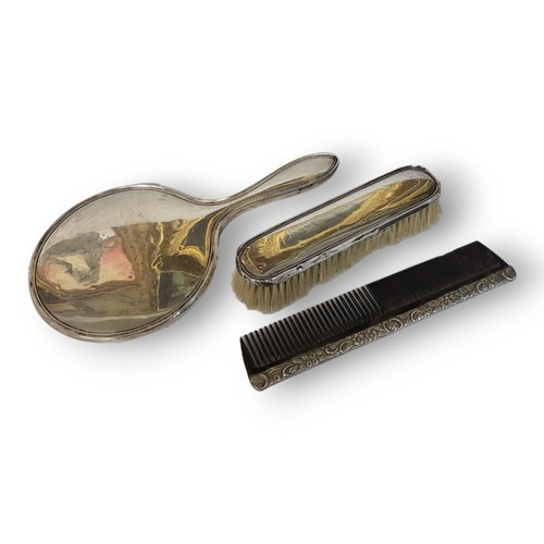 118 - A MATCHED EARLY 20TH CENTURY SILVER DRESSING TABLE BRUSH AND COMB SET
Comprising a hand mirror and c... 