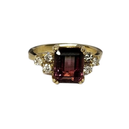 31A - AN 18CT GOLD, DIAMOND AND WATERMELON TOURMALINE RING
The rectangular cut stone flanked by diamonds.
... 