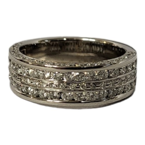 39A - AN 18CT WHITE GOLD AND DIAMOND THREE ROW HALF ETERNITY RING 
Having pavé set round cut diamonds.
(ap... 