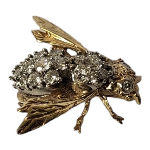 35A - A 14CT GOLD AND DIAMOND BEE BROOCH
Having an arrangement of round cut diamonds forming a cluster and... 