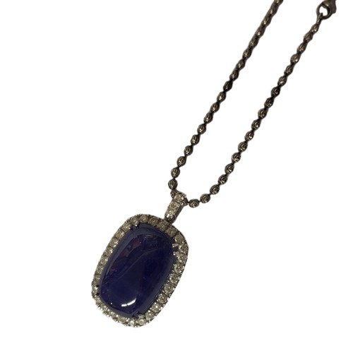 42A - A WHITE METAL, DIAMOND AND TANZANITE PENDANT NECKLACE 
Rectangular cabochon cut stone edged with rou... 