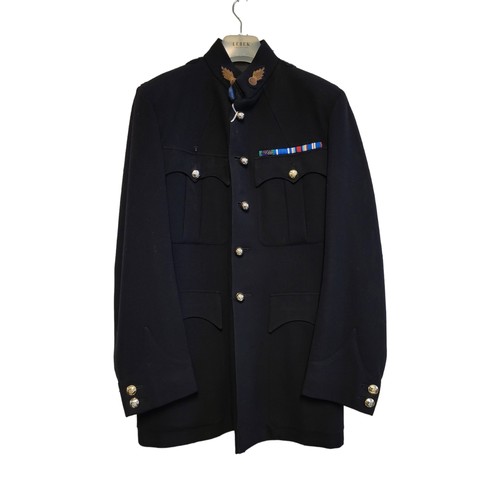 18 - A BRITISH ROYAL ARTILLERY NUMBER 1 JACKET
Black jacket with collar badges and metal buttons, the rib... 