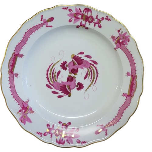 48 - MEISSEN, A SET OF EIGHT MID 19TH CENTURY COURT DRAGON IN PURPLE CAMAIEU SERVING PLATES 
Each elabora... 