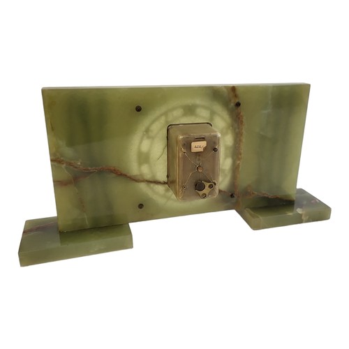 59 - A MID CENTURY GREEN ONYX RECTANGULAR MANTLE CLOCK
With gilt brass mounts, circular dial with Arabic ... 