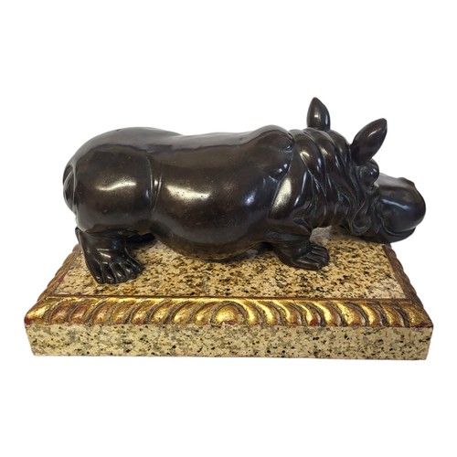 61 - A MID CENTURY BRONZE AND MARBLE HIPPOPOTAMUS
Standing pose with exaggerated features on a rectangula... 