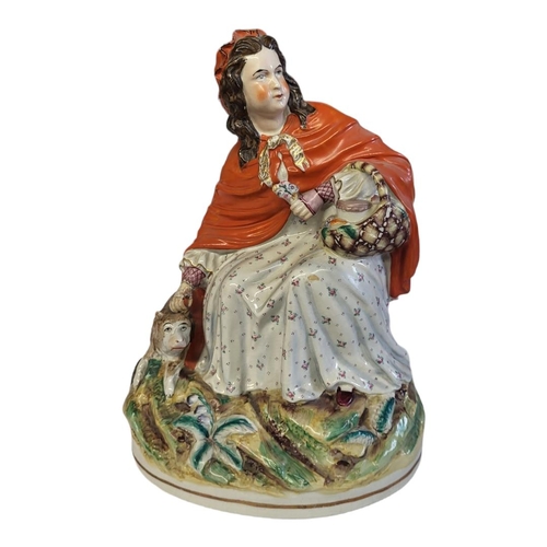 140 - STAFFORDSHIRE, A FIGURAL GROUP OF LITTLE RED RIDING HOOD
Polychrome painted with bright multicoloure... 