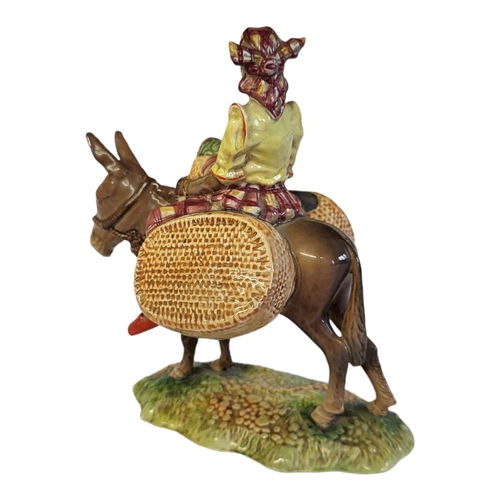121 - A RARE BESWICK POTTERY FIGURAL GROUP, A YOUNG JAMAICAN GIRL SITTING ON A DONKEY
Titled ‘Susie Jamaic... 