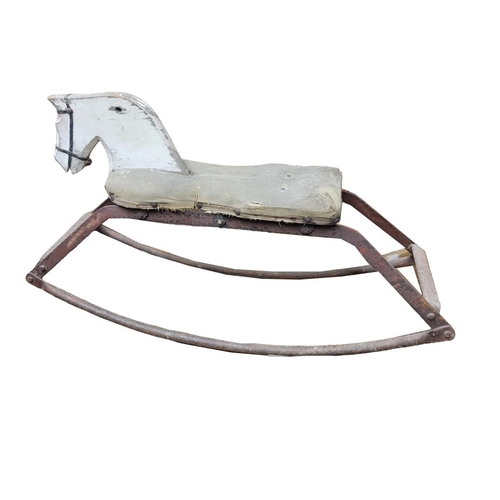 154 - AN EARLY/MID CENTURY PAINTED PINE AND IRON CHILDS ROCKING HORSE.
(83cm x 46cm)

Condition: worn some... 