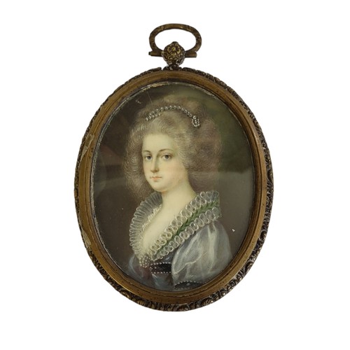 461 - A 19TH CENTURY OVAL MINIATURE PAINTING ON IVORY, PORTRAIT OF A LADY WITH PEARL HEADDRESS 
Indistinct... 