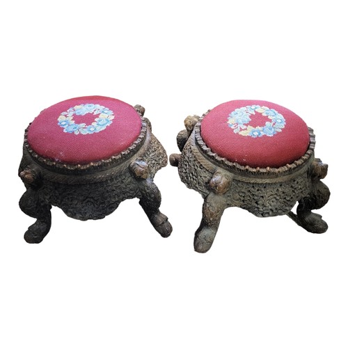 502 - A PAIR OF LATE 19TH/EARLY 20TH CENTURY BURMESE CARVED WOODEN FOOTSTOOLS
Circular form with inset tap... 