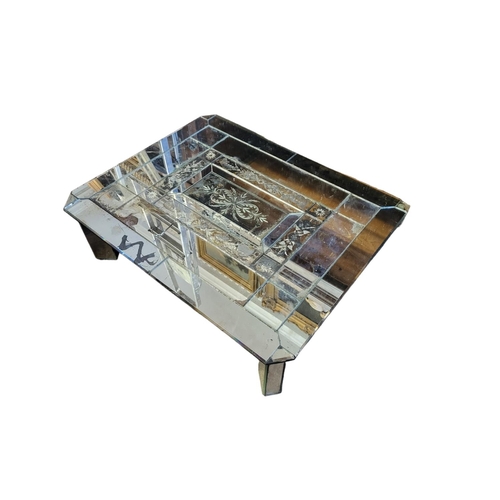 505 - A MID CENTURY VENETIAN MIRRORED COFFEE TABLE
With etched decoration and canted corners, on square bl... 